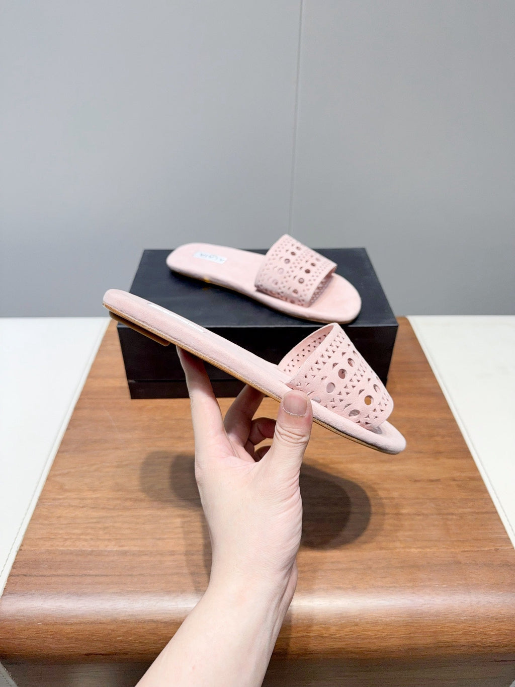 ALAIA FLAT SANDALS WITH PERFORATED STRAPS 25S IN LIGHT PINK SUEDE