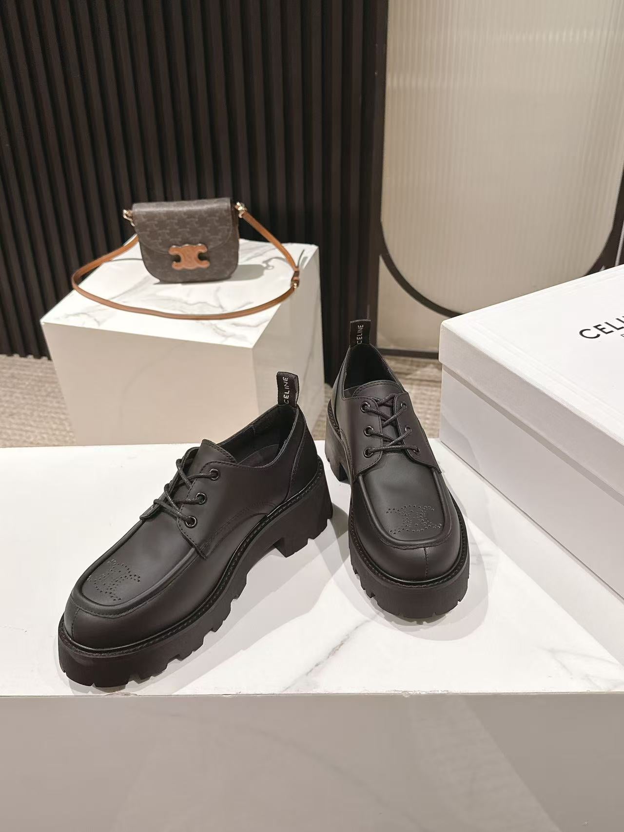 CELINE 25S THICK SOLED LOAFERS 50MM IN BLACK CALFSKIN