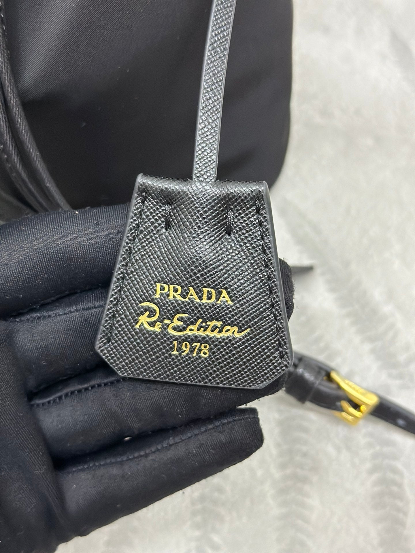 BUCKET BAG 19 IN BLACK RE-NYLON AND CALFSKIN HANDLE