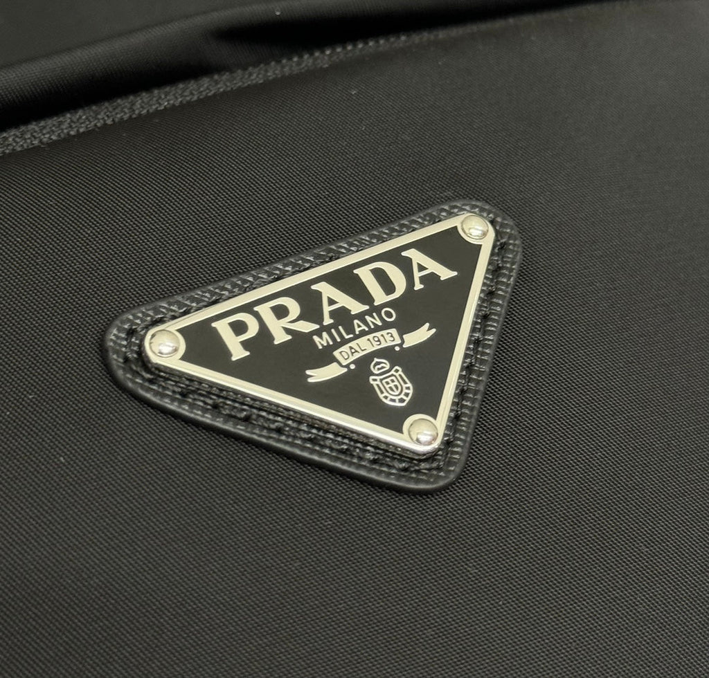 PRADA 25S BACKPACK 39 IN BLACK RE-NYLON AND SAFFIANO CALFSKIN