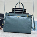 PRADA 25S LUX SOFT BAG 42 IN BLUE GLOSSY CALFSKIN GOLD HARDWRE