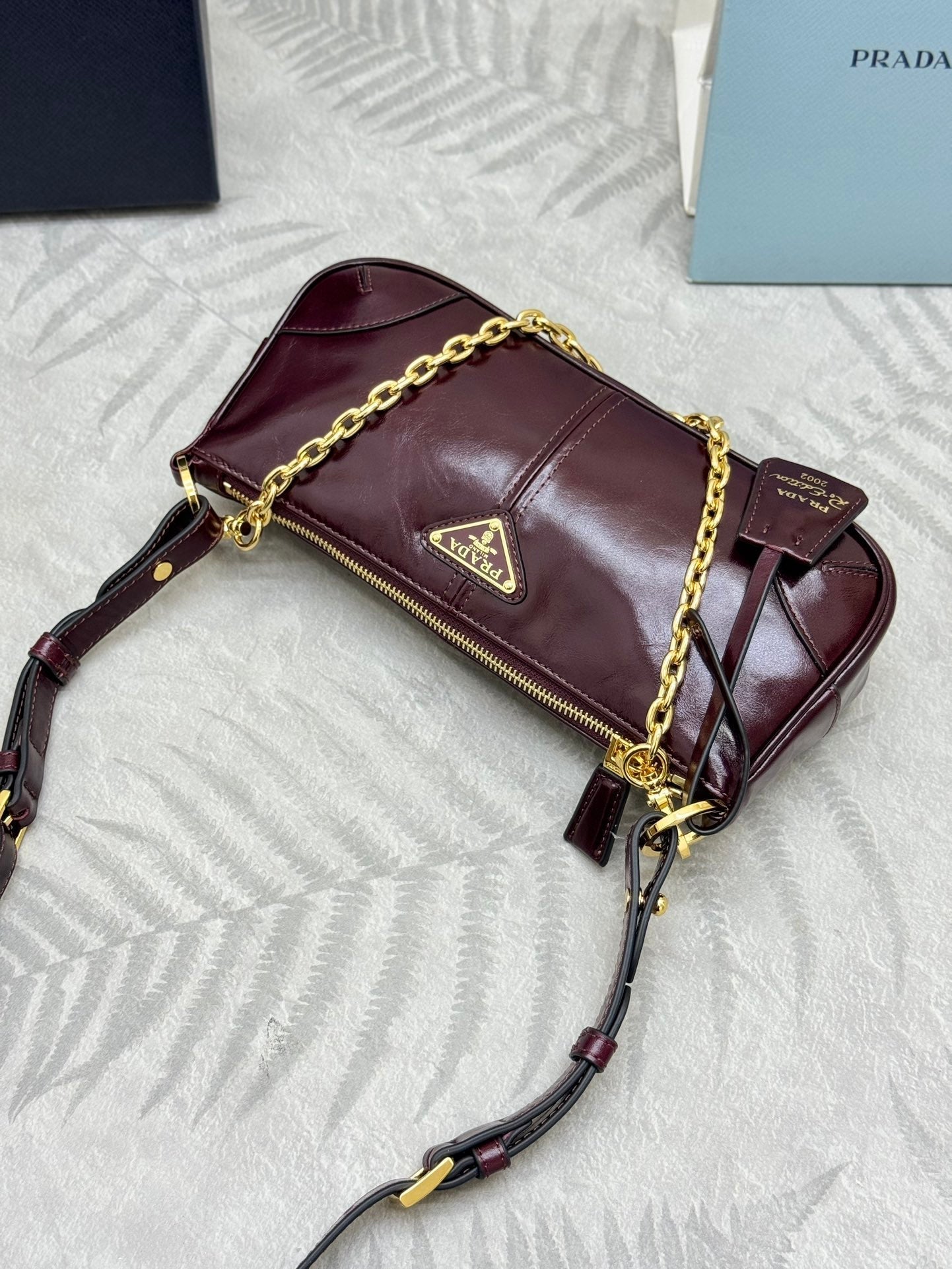 PRADA 25S RE-EDITION 2002 MEDIUM SHOULDER BAG 26 IN BURGUNDY CALFSKIN GOLD HARDWARE