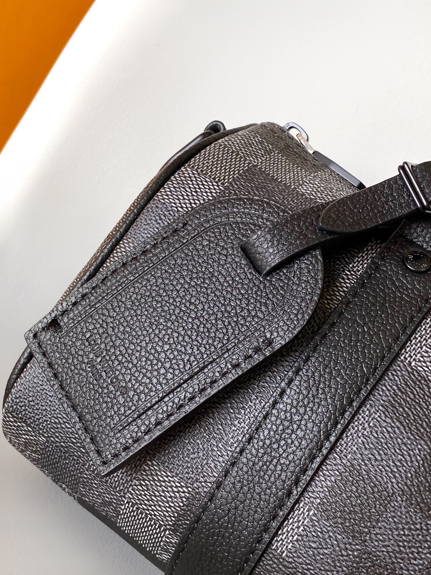 LV 25S KEEPALL BANDOULIÈRE 25 BAG IN DAMOFLAGE BLACK CALFSKIN