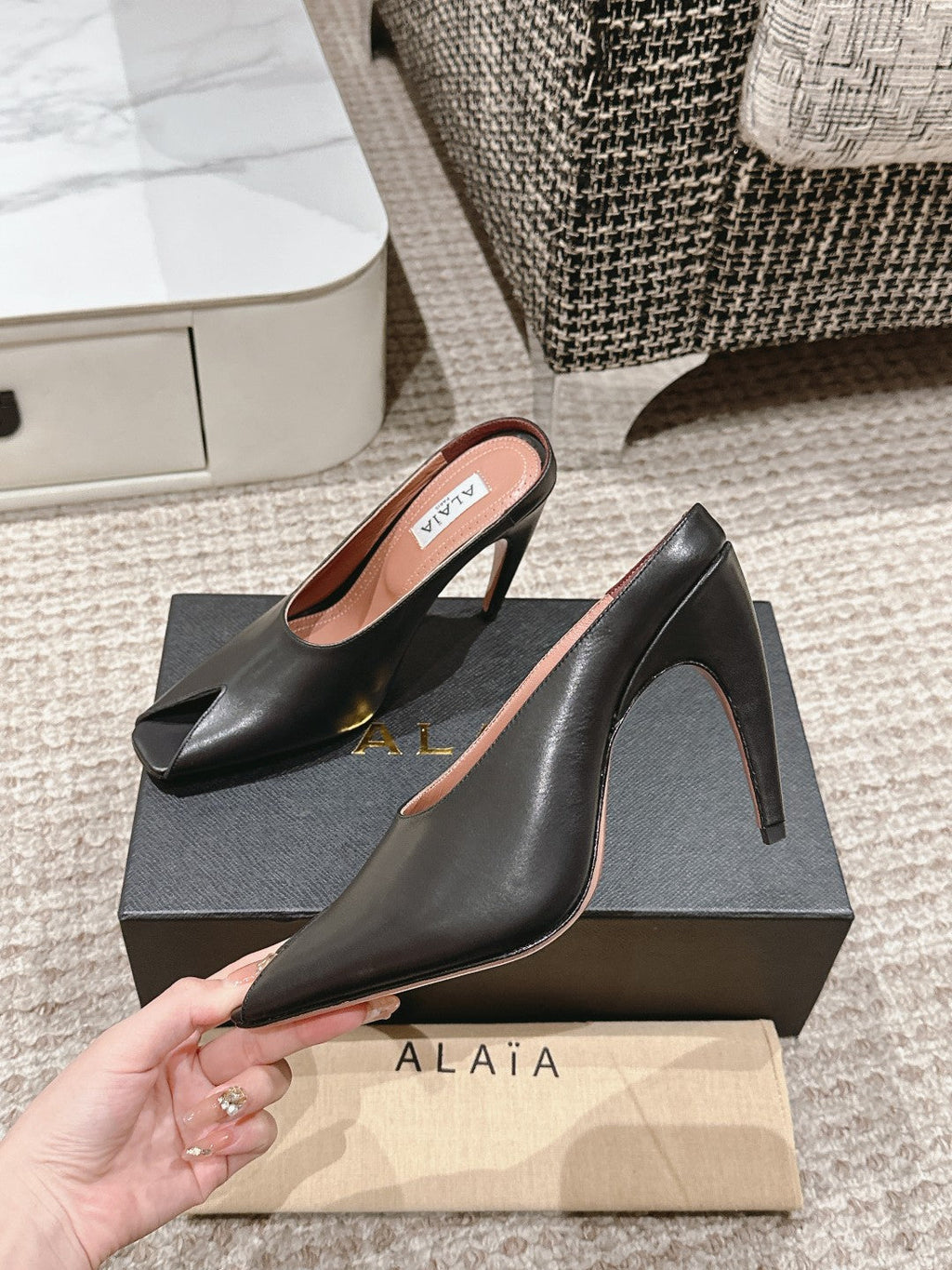 ALAIA SPIKE JEWEL MULES IN BLACK CALFSKIN