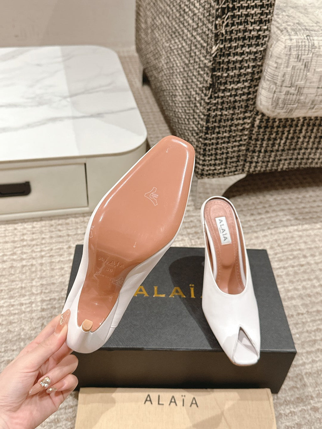 ALAIA SPIKE JEWEL MULES IN WHITE CALFSKIN