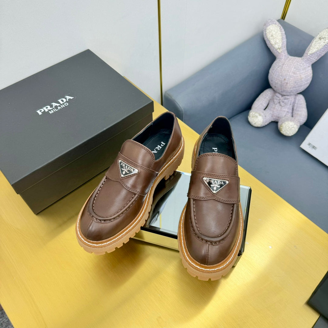LOAFER WITH TRIANGLE LOGO IN CHOCOLATE BROWN CALFSKIN