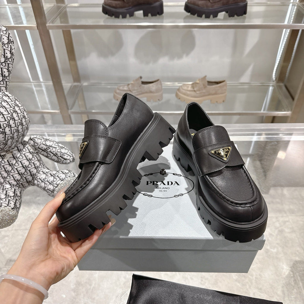 PRADA 25S THICK-SOLE LOAFERS 60 MM IN BLACK SMOOTH CALFSKIN