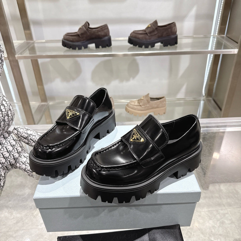 PRADA 25S THICK-SOLE LOAFERS 60 MM IN BLACK CALFSKIN