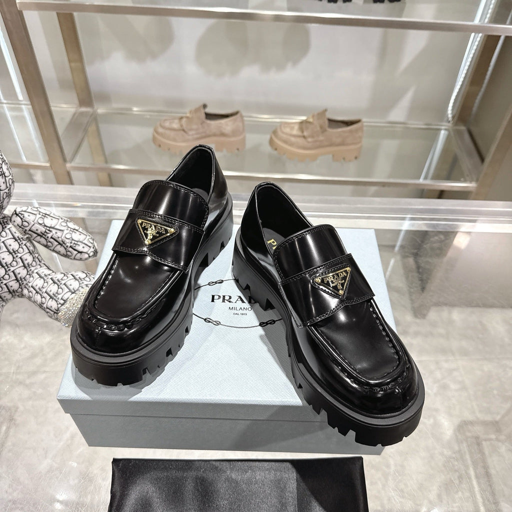 PRADA 25S THICK-SOLE LOAFERS 60 MM IN BLACK CALFSKIN