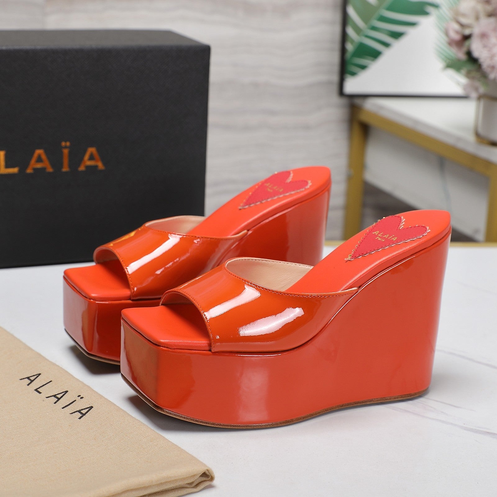 ALAIA PLATFORM WEDGE IN VIVID ORANGE LAMBSKIN WITH RED HEART