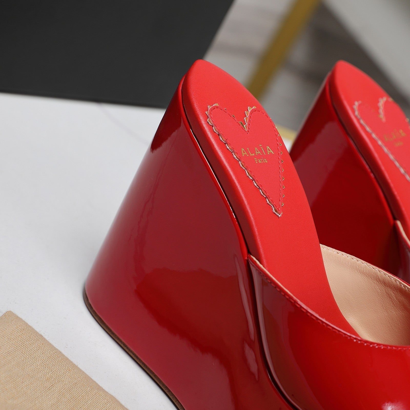 ALAIA PLATFORM WEDGE IN CHERRY RED LAMBSKIN WITH HEART EMBROIDERED