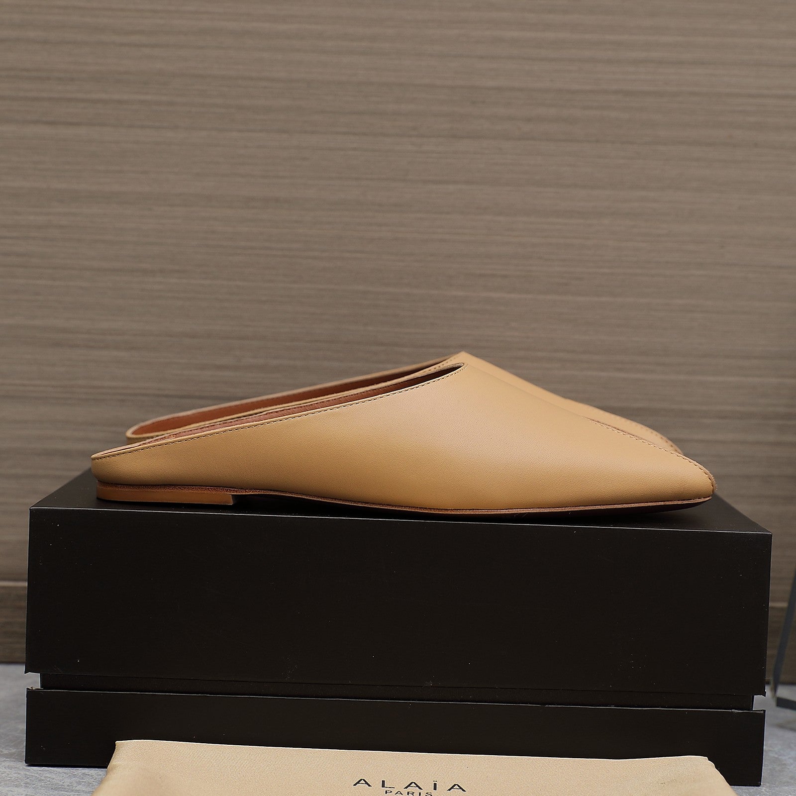 ALAIA FLAT MULE IN SEPIA TAN LAMBSKIN