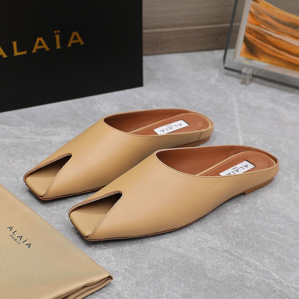 ALAIA FLAT MULE IN SEPIA TAN LAMBSKIN