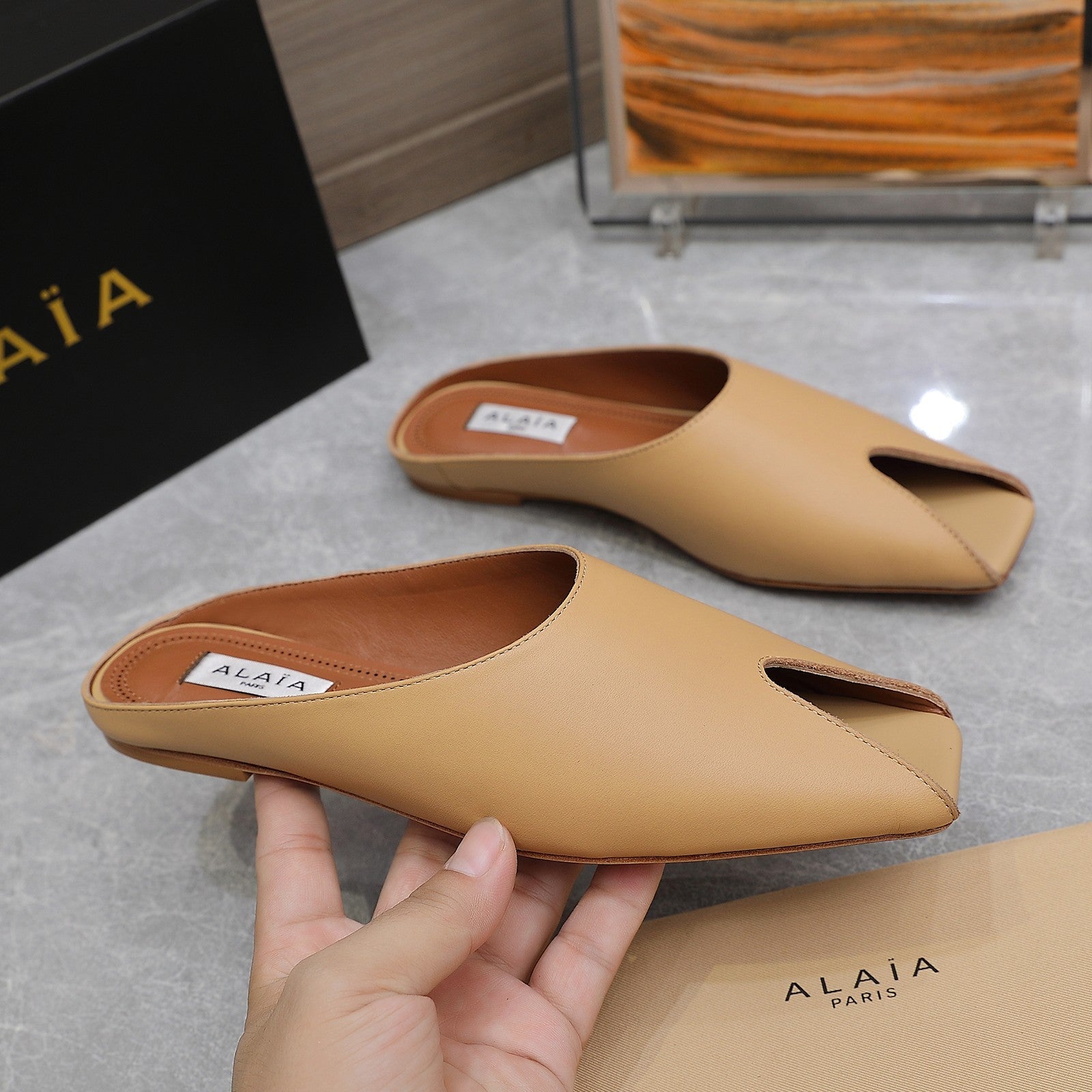 ALAIA FLAT MULE IN SEPIA TAN LAMBSKIN