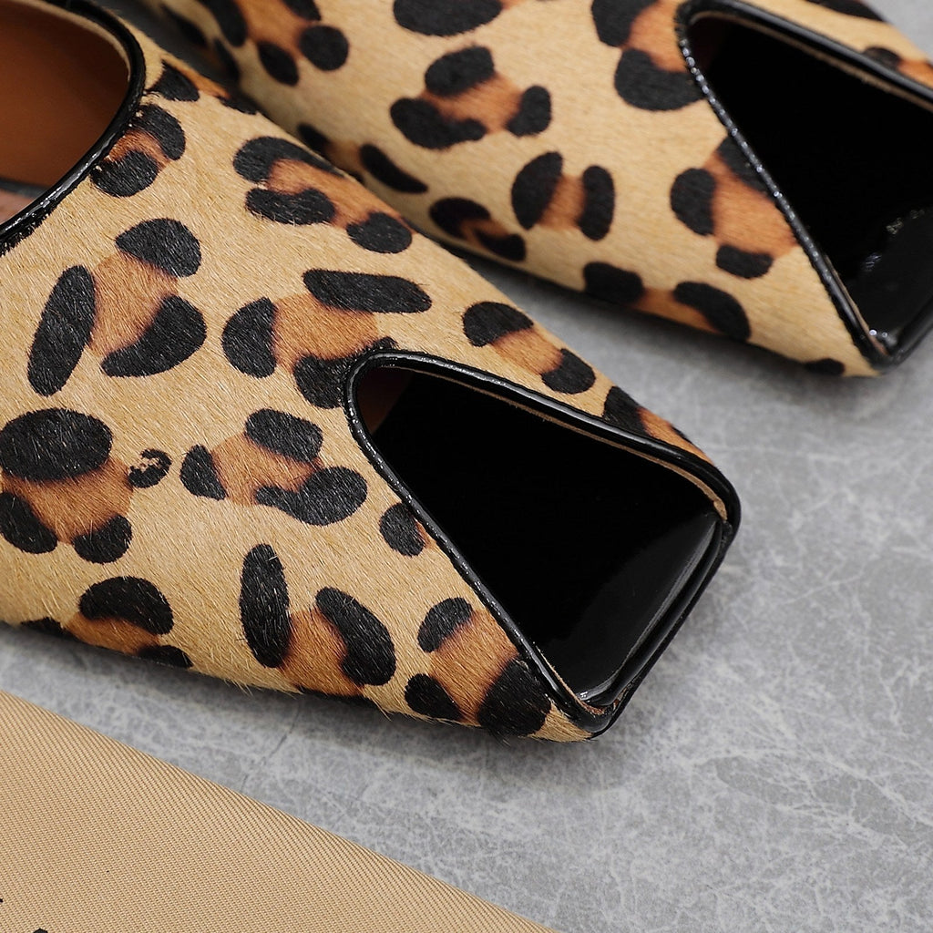 ALAIA FLAT MULE IN LEOPARD LAMBSKIN