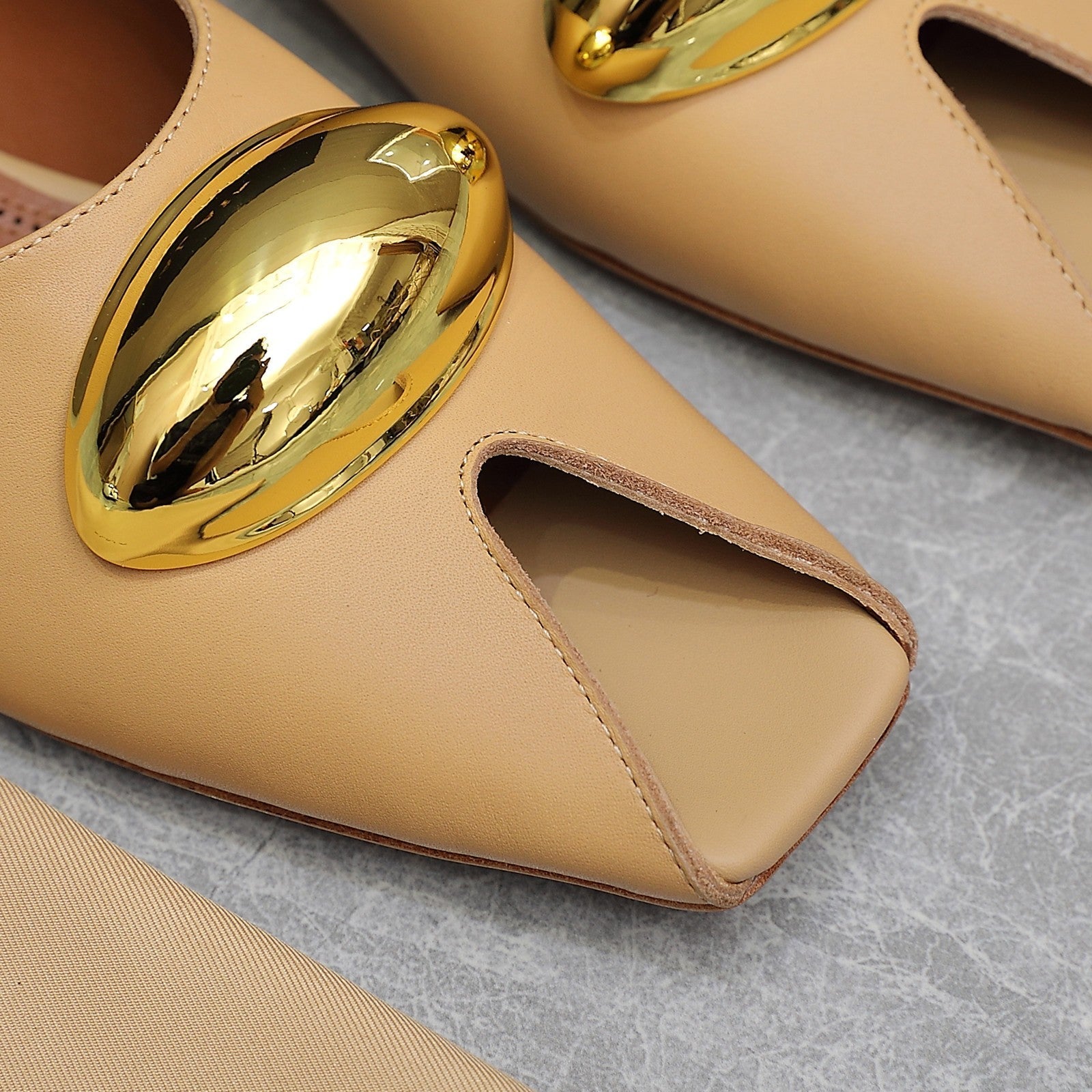 ALAIA FLAT MULE IN SEPIA TAN LAMBSKIN WITH GOLD HARDWARE