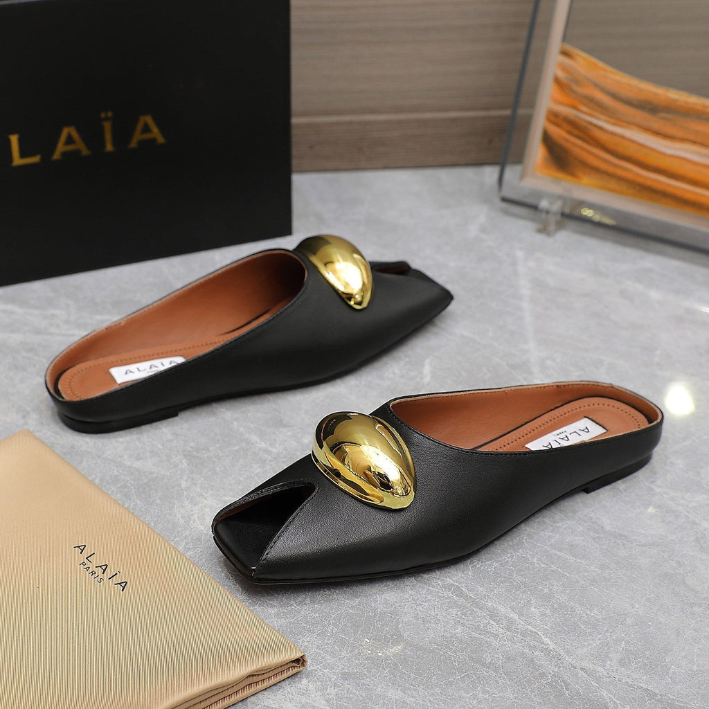 ALAIA FLAT MULE IN BLACK LAMBSKIN WITH GOLD HARDWARE