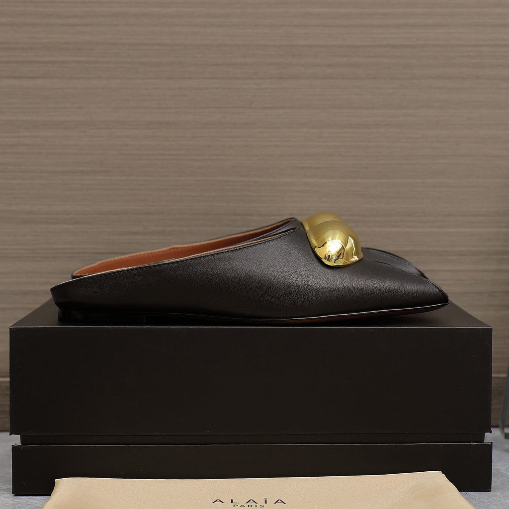 ALAIA FLAT MULE IN BLACK LAMBSKIN WITH GOLD HARDWARE