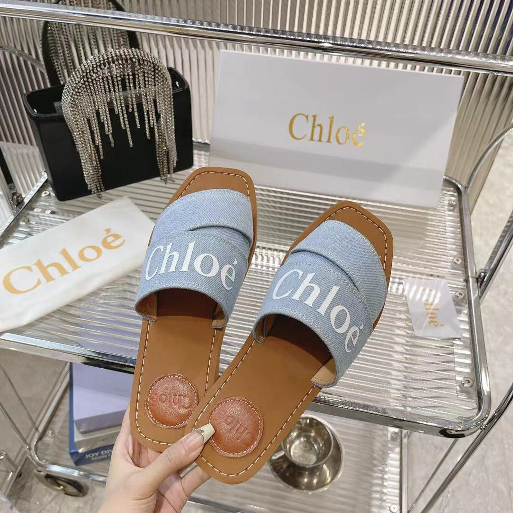 CHLOÉ WOODY MULE IN LIGHT BLUE DENIM WITH WHITE LOGO