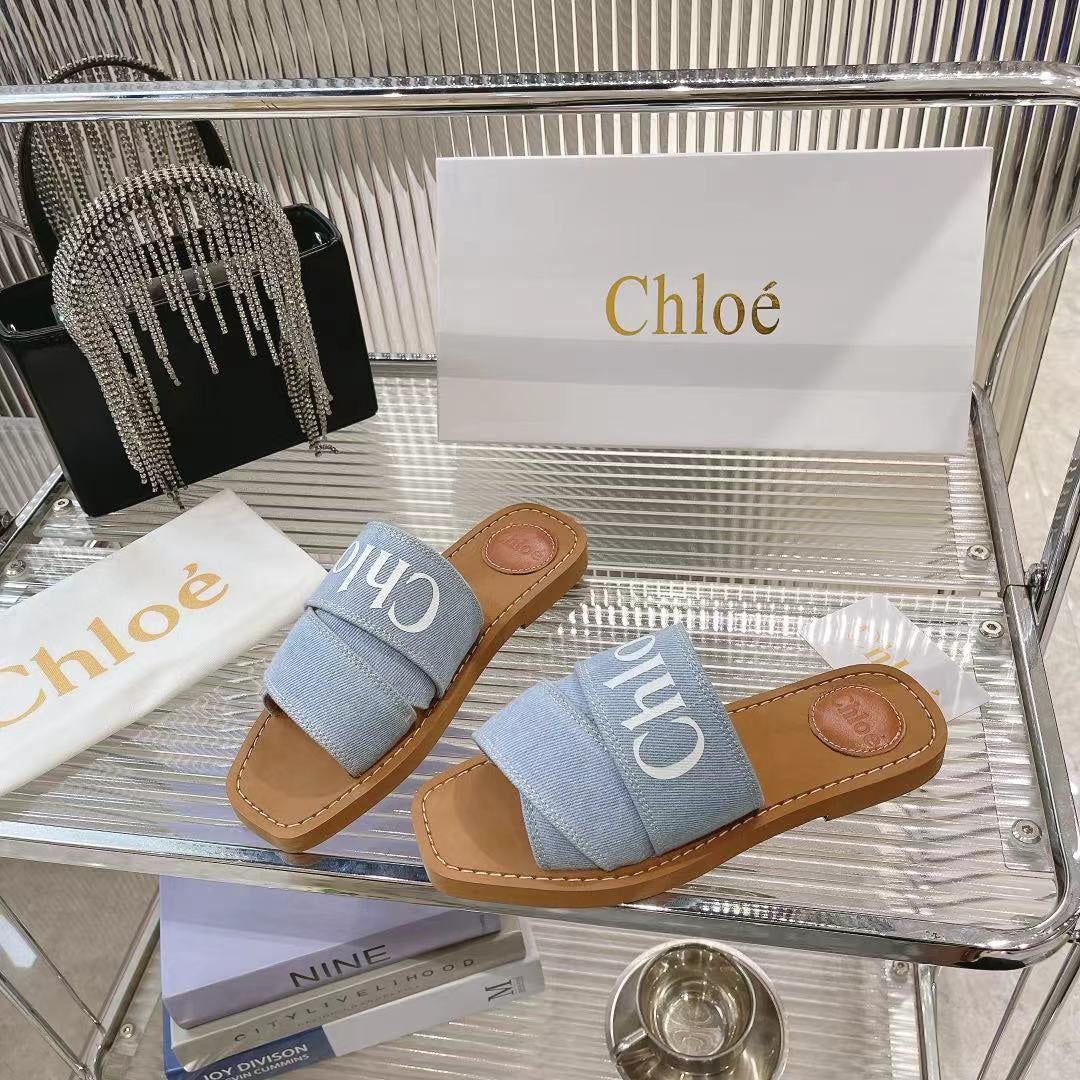 CHLOÉ WOODY MULE IN LIGHT BLUE DENIM WITH WHITE LOGO