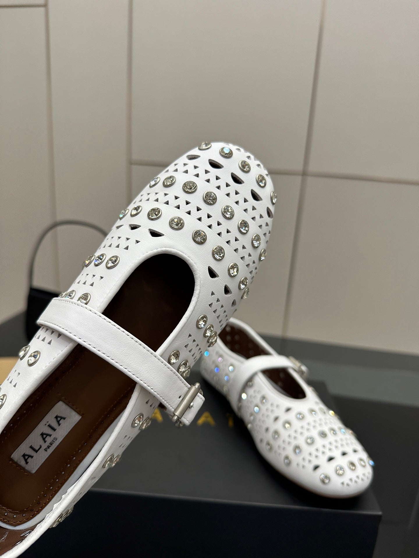 ALAIA BALLET SHOES 25S IN WHITE LAMBSKIN WITH CRYSTAL DETAILING