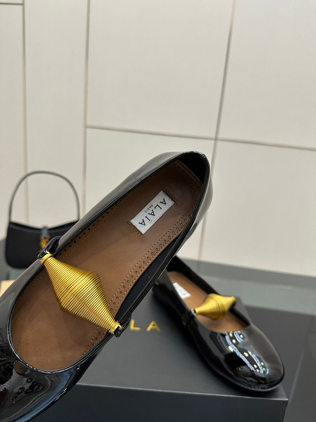 ALAIA BALLET SHOES 25S IN BLACK PATENT LEATHER WITH GOLD HARDWARE