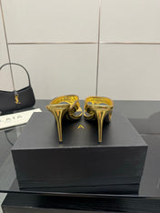 ALAIA HEELED THONG 25S IN GOLD PATENT LEATHER