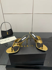 ALAIA HEELED THONG 25S IN GOLD PATENT LEATHER