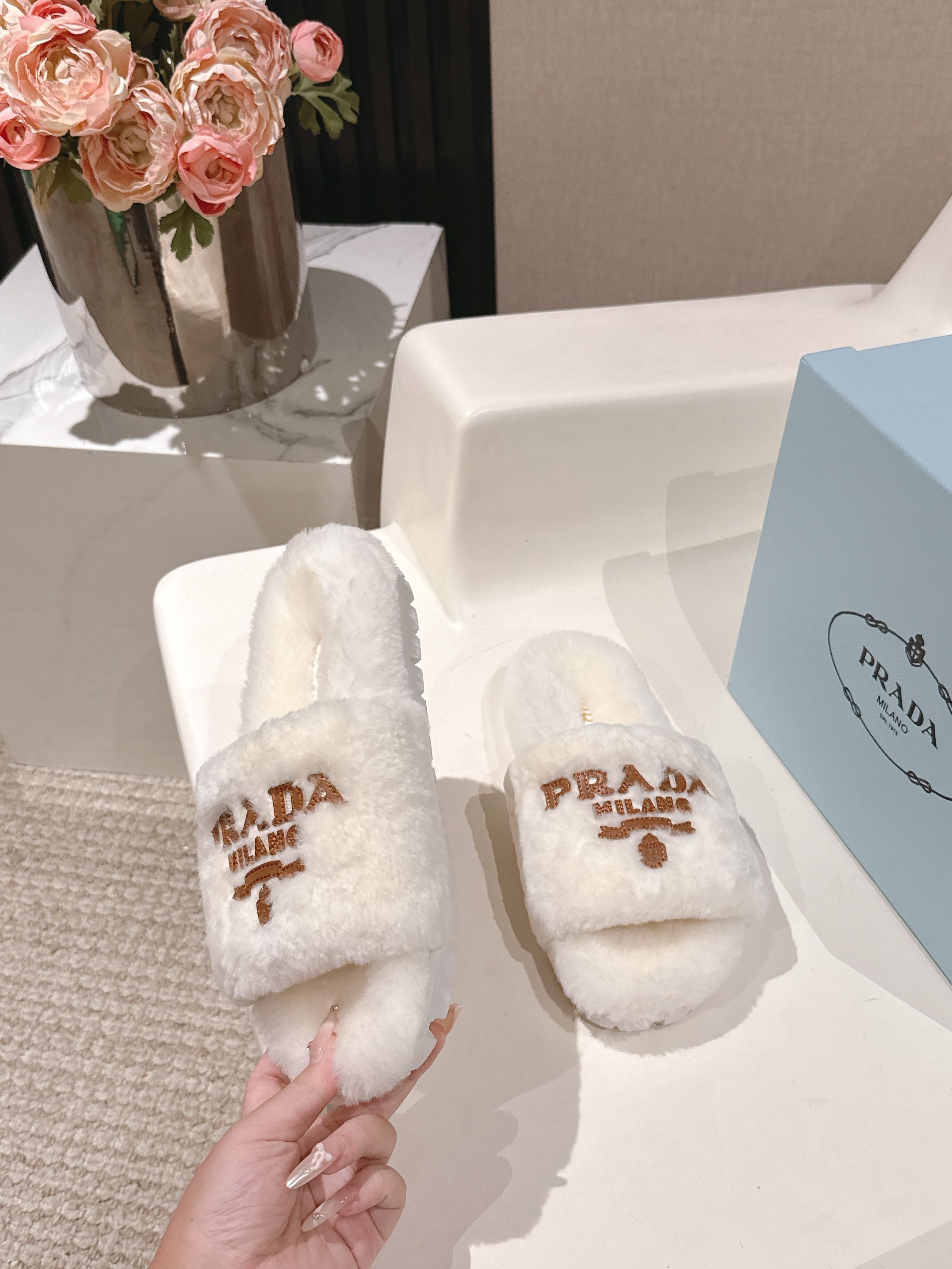 PRADA 25S FLAT MULES IN WHITE RABBIT FUR