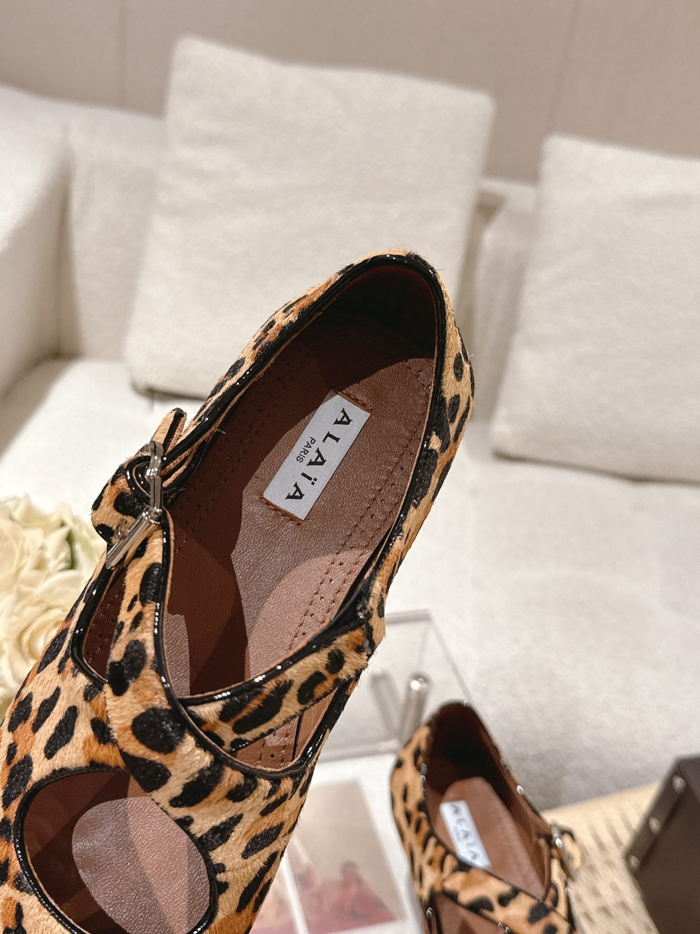 ALAIA 25S CRISS CROSS BALLET FLATS IN LEOPARD SUEDE