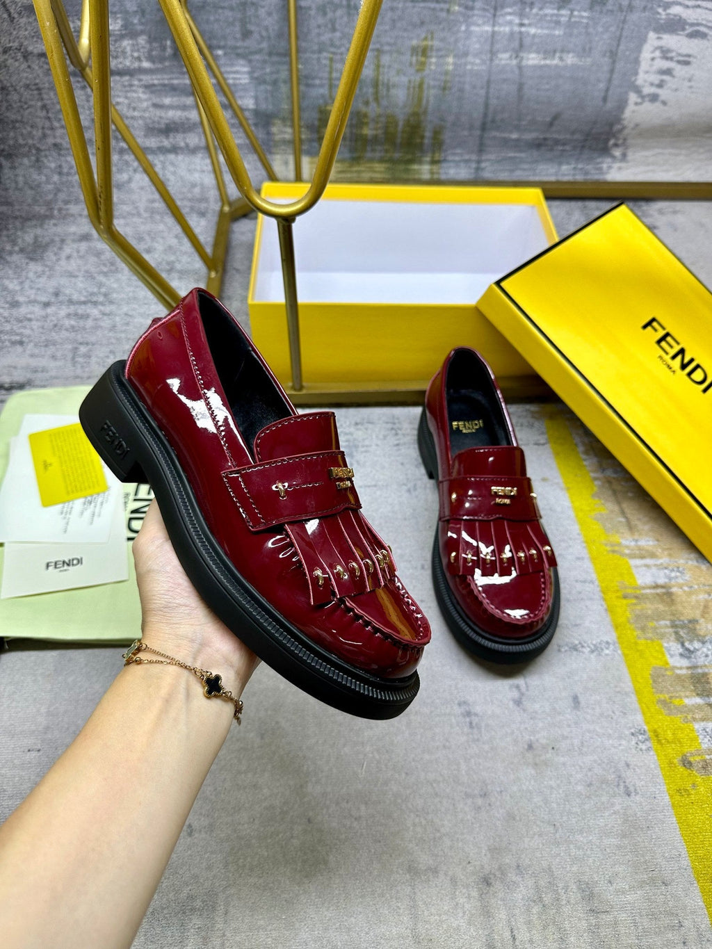 FENDI BAGUETTE LOAFERS IN MAROON RED CALFSKIN WITH GOLD HARDWARE