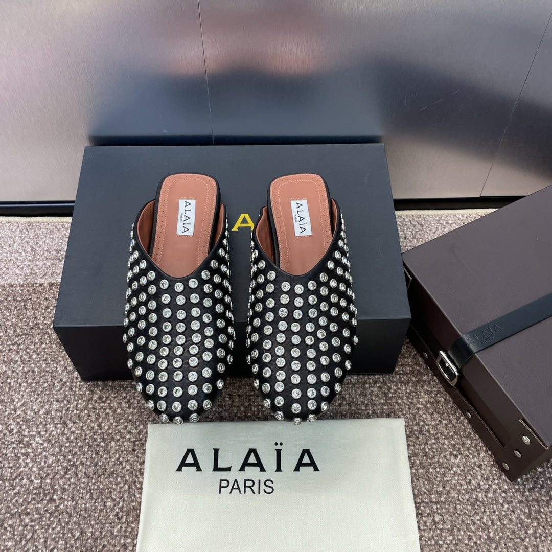 ALAIA FLAT MULES 25S IN BLACK LAMBSKIN EMBELLISHED WITH CRYSTALS