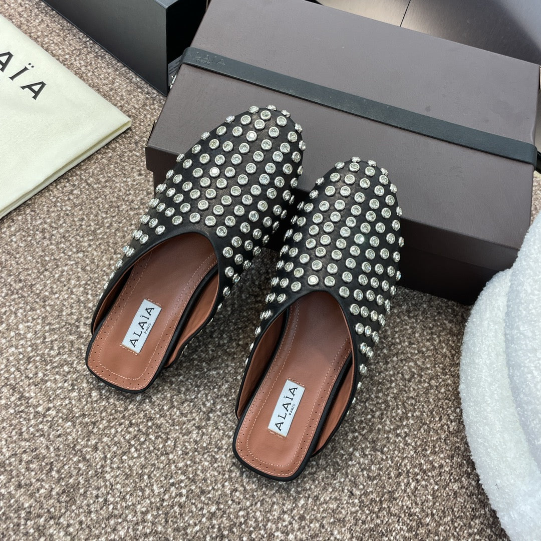 ALAIA FLAT MULES 25S IN BLACK LAMBSKIN EMBELLISHED WITH CRYSTALS