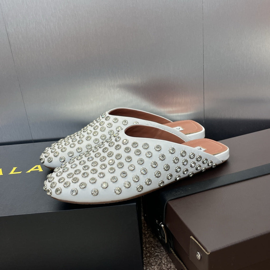ALAIA FLAT MULES 25S IN WHITE LAMBSKIN EMBELLISHED WITH CRYSTALS