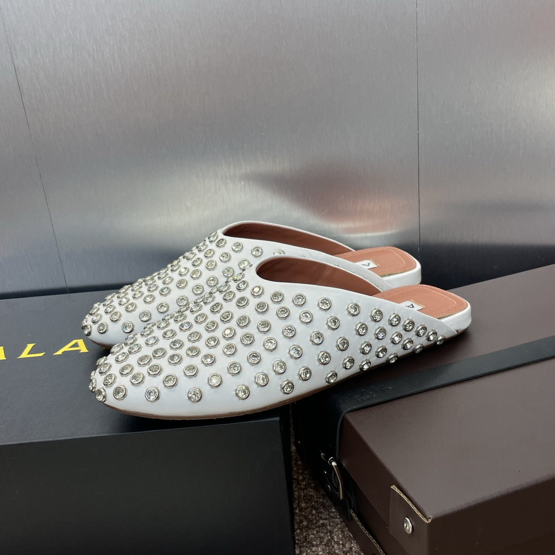 ALAIA FLAT MULES 25S IN WHITE LAMBSKIN EMBELLISHED WITH CRYSTALS