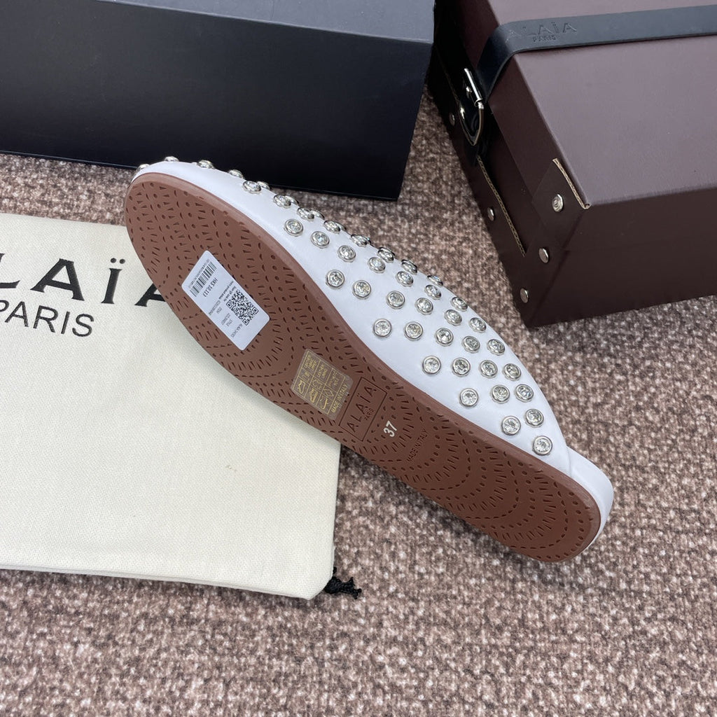 ALAIA FLAT MULES 25S IN WHITE LAMBSKIN EMBELLISHED WITH CRYSTALS