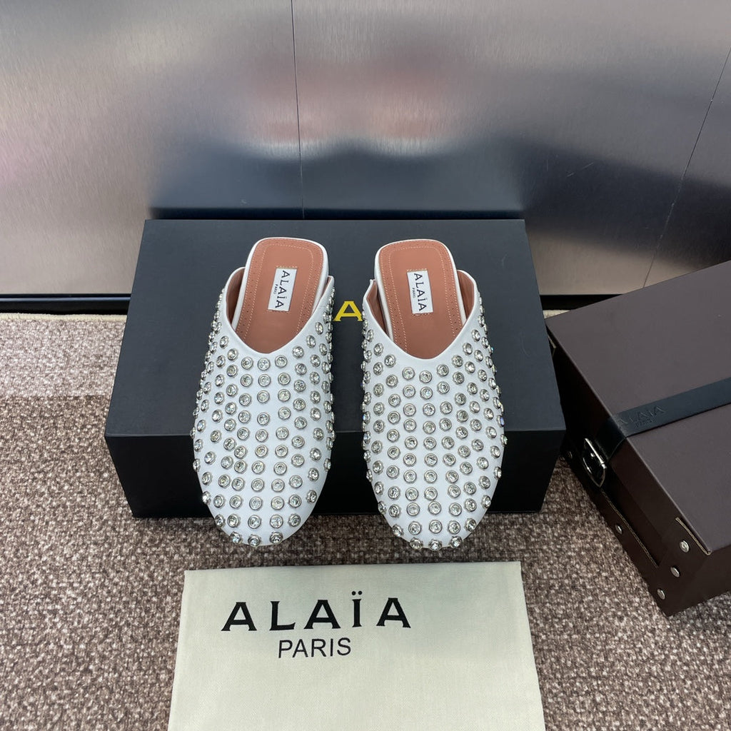 ALAIA FLAT MULES 25S IN WHITE LAMBSKIN EMBELLISHED WITH CRYSTALS
