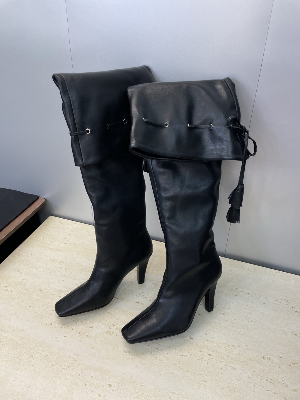 YSL 25S HIGH‑HEEL FRINGED MARTIN BOOTS 90 MM IN BLACK LAMBSKIN