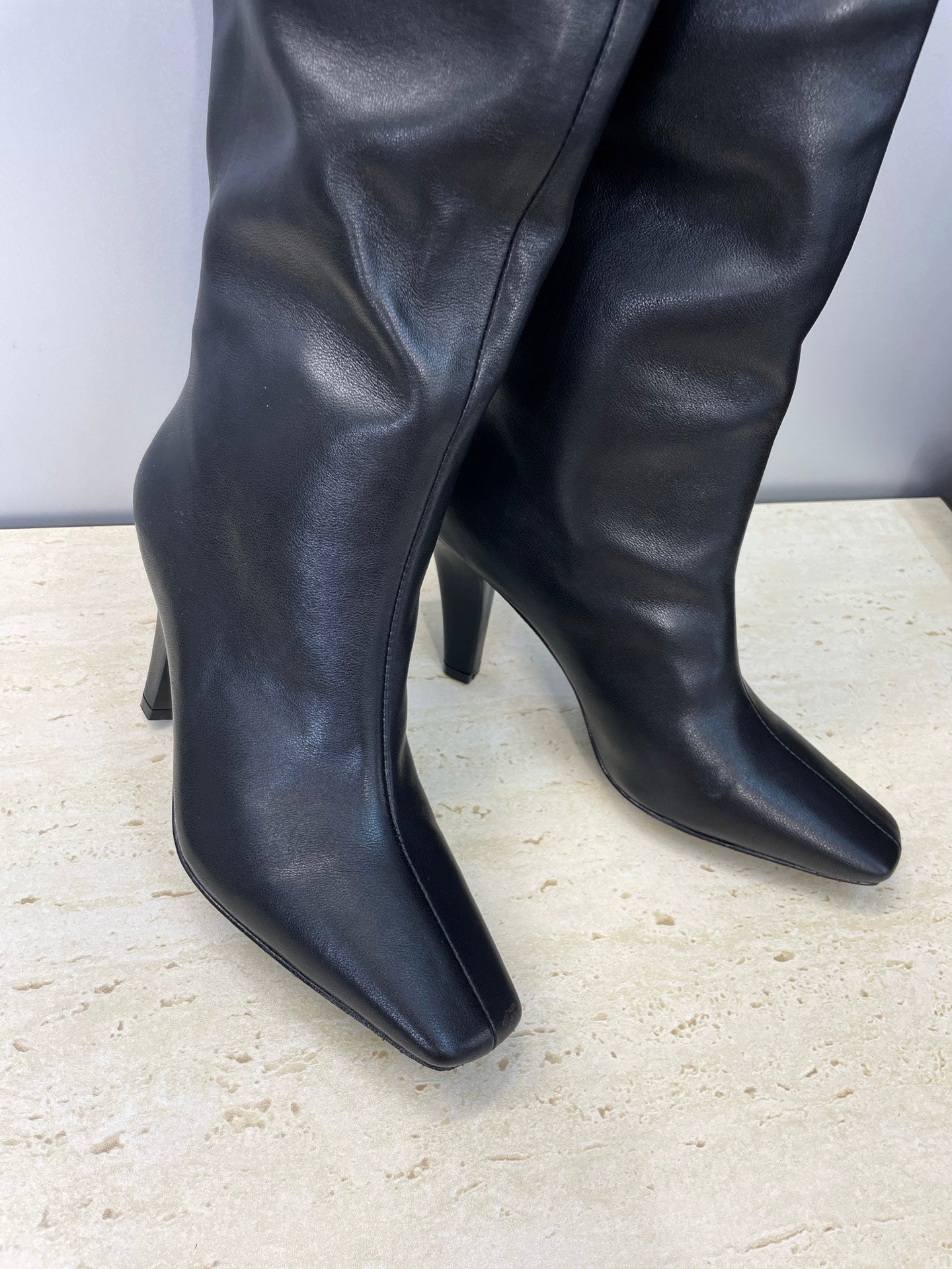 YSL 25S HIGH‑HEEL FRINGED MARTIN BOOTS 90 MM IN BLACK LAMBSKIN