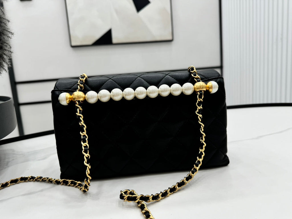 CHANEL 25S FLAP BAG 23 CM IN BLACK LAMBSKIN WITH PEARL TOP HANDLE