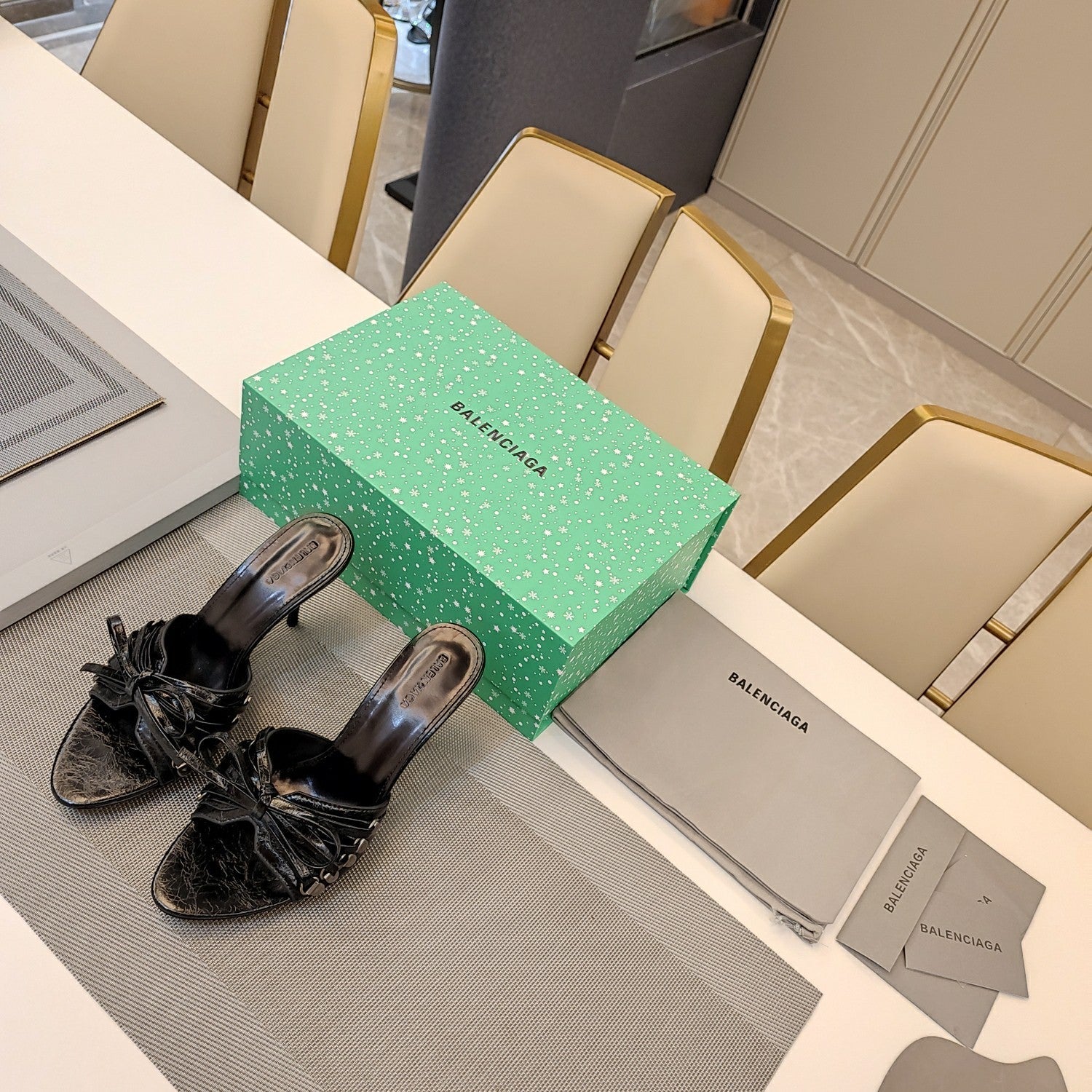 BOW-EMBELLISHED HIGH MULES IN BLACK SHEEPSKIN