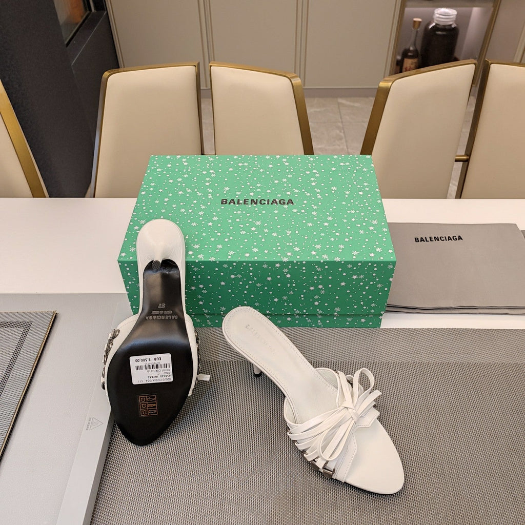 BOW-EMBELLISHED HIGH MULES IN WHITE SHEEPSKIN