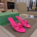 BOW-EMBELLISHED HIGH MULES IN HOT PINK SHEEPSKIN