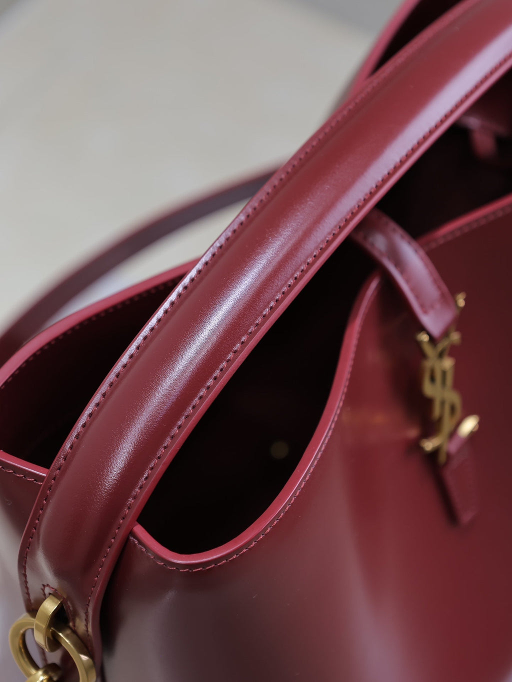 YSL 25S LE 5 À 7 BUCKET 26 IN DARK BURGUNDY CALFSKIN GOLD HARDWARE