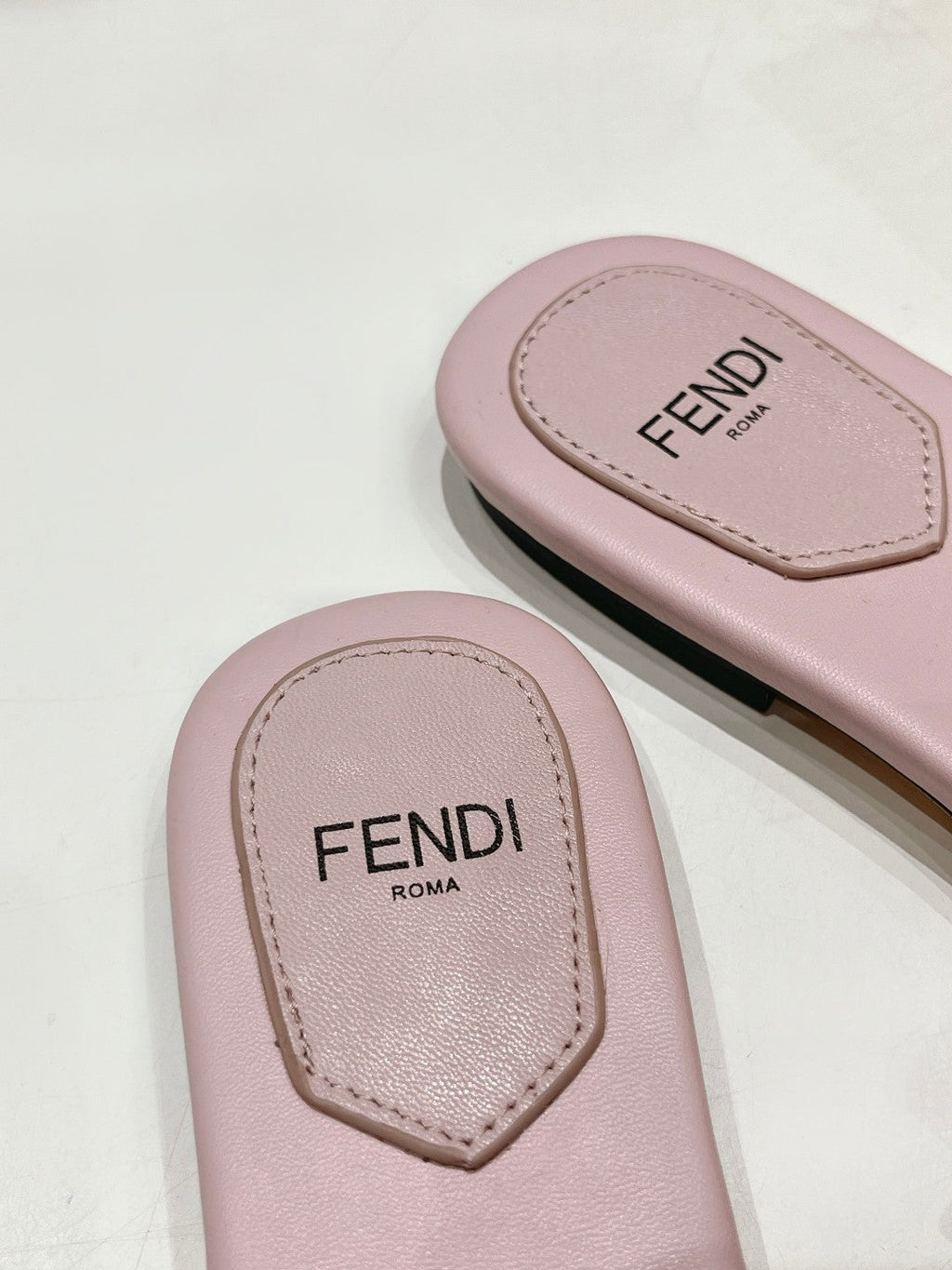 FENDI BAGUETTE SLIDES IN LIGHT PINK LAMBSKIN