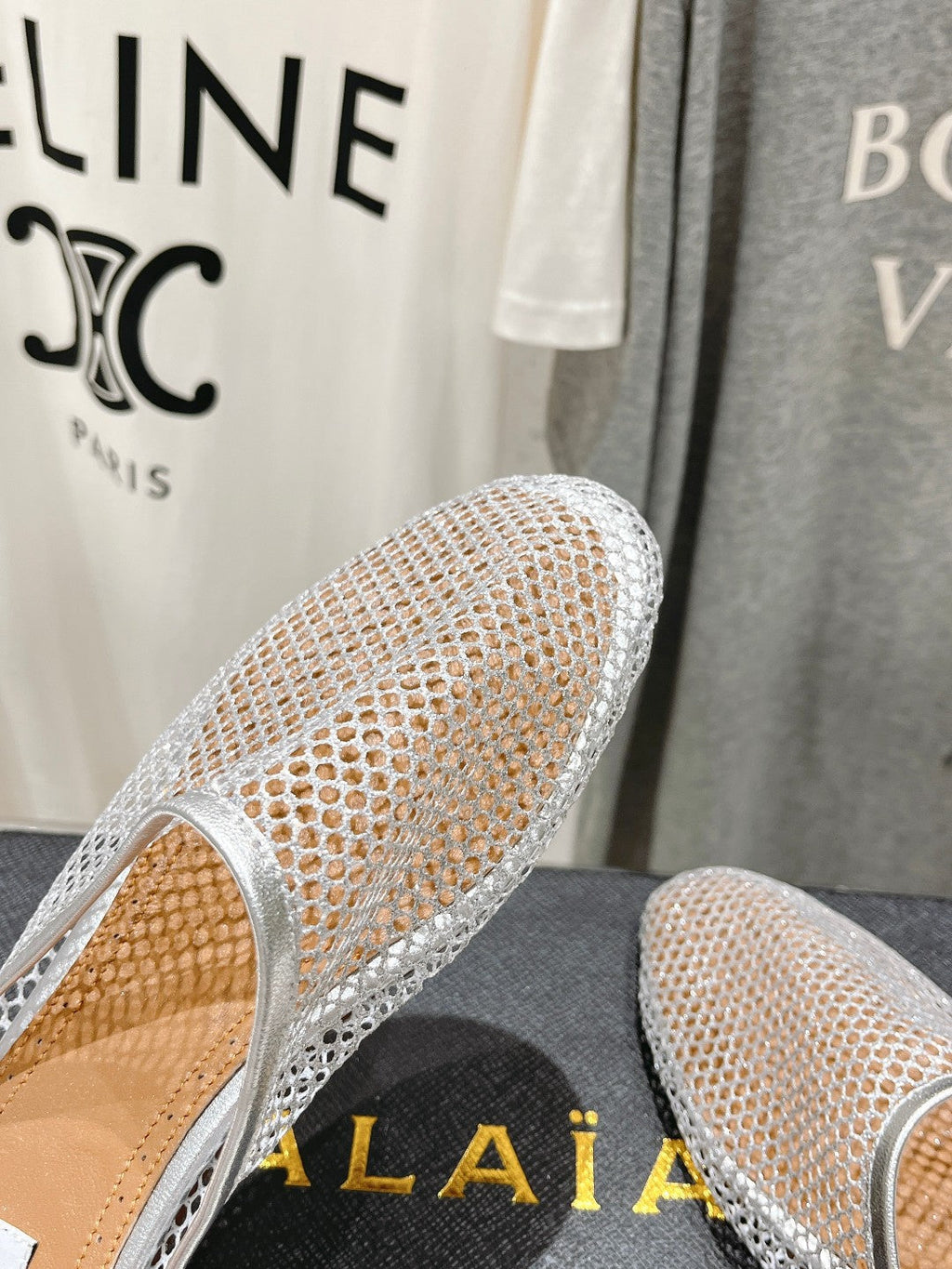 ALAIA FLAT MULES IN SILVER MESH FISHNET