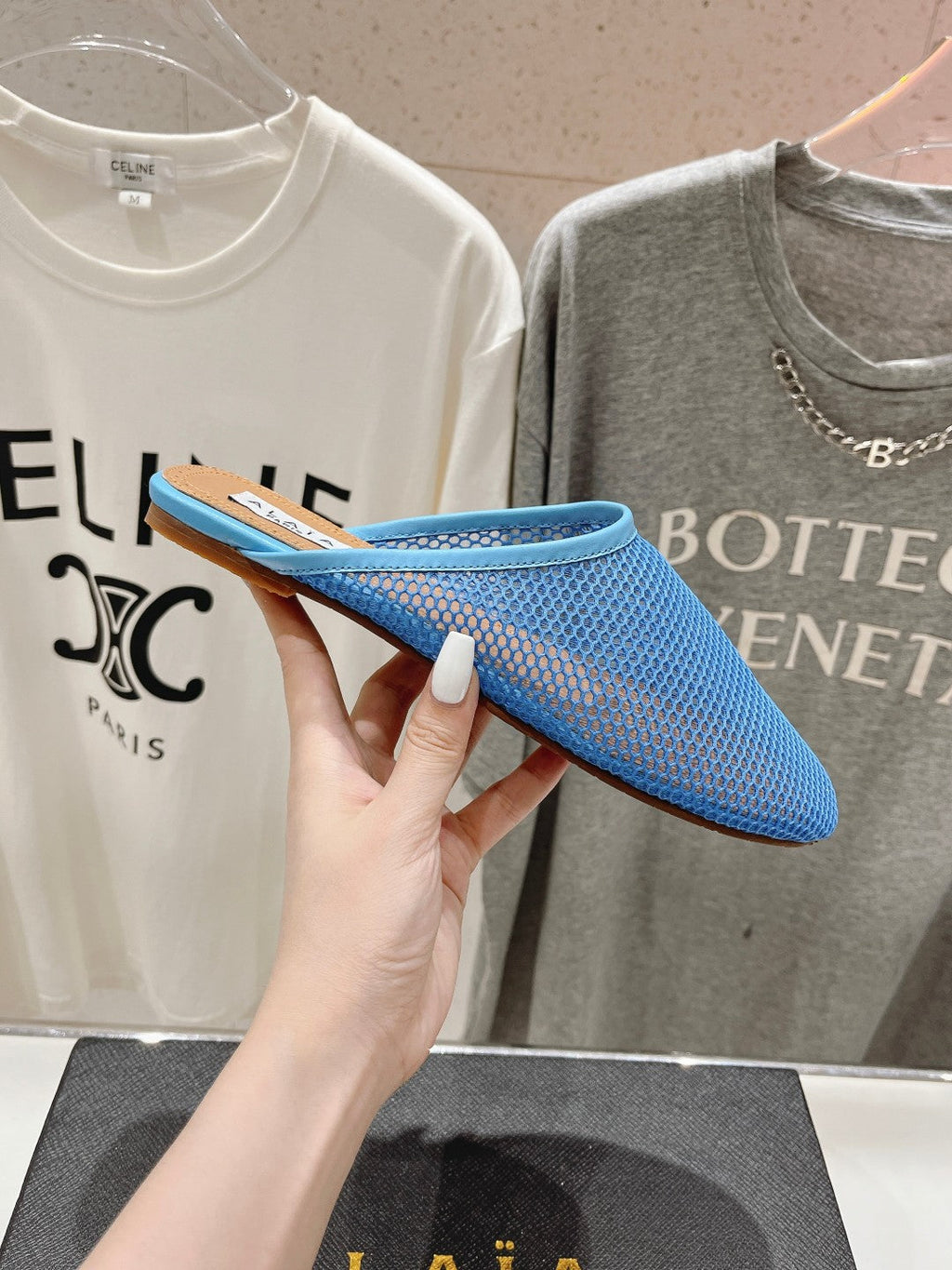 ALAIA FLAT MULES IN CERULEAN BLUE MESH FISHNET