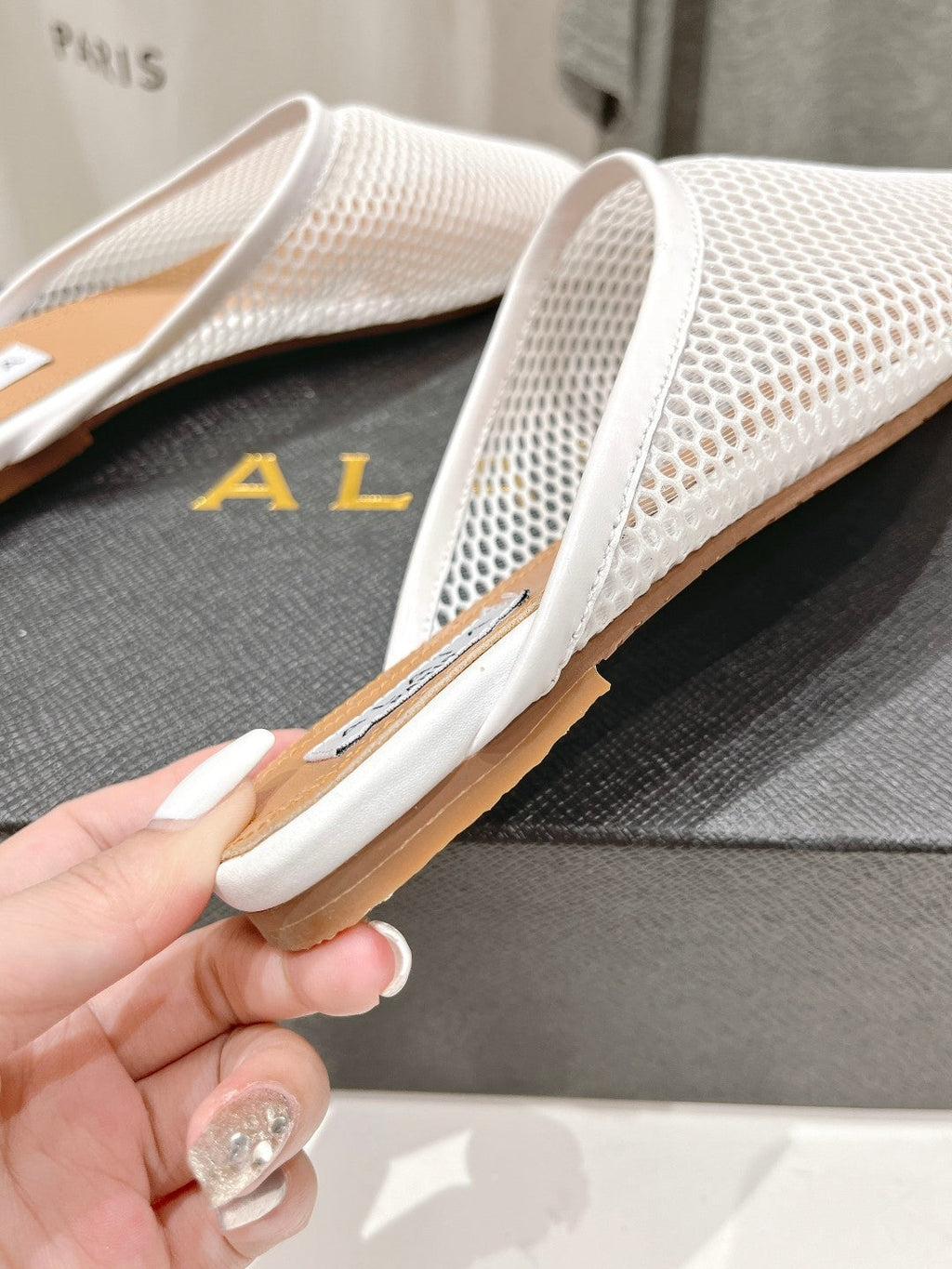 ALAIA FLAT MULES IN WHITE MESH FISHNET