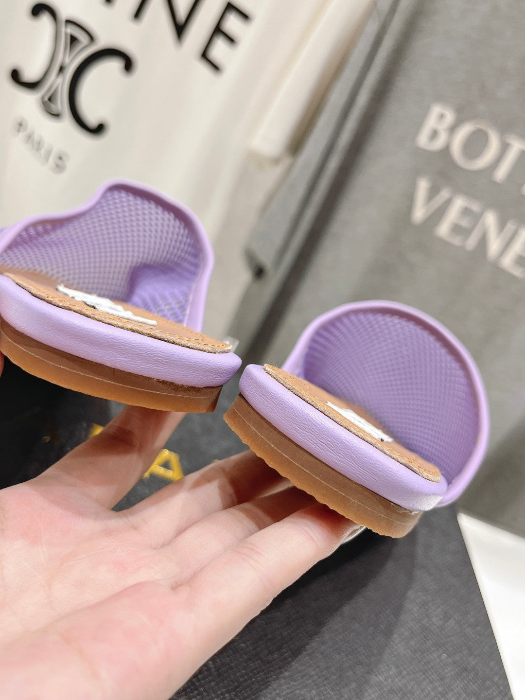 ALAIA FLAT MULES IN LIGHT PURPLE MESH FISHNET