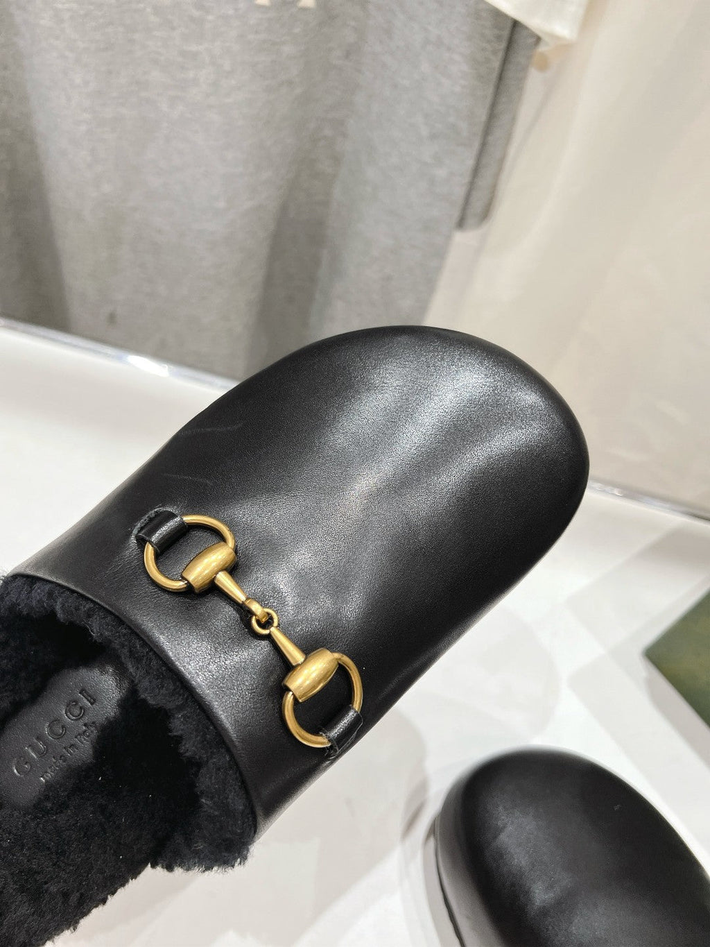 HORSEBIT MULE IN BLACK CALFSKIN AND FLEECE LINING